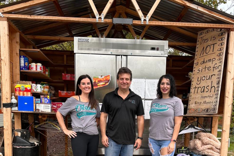 The Austin team, two women and one man, filling a local Blessing Box.